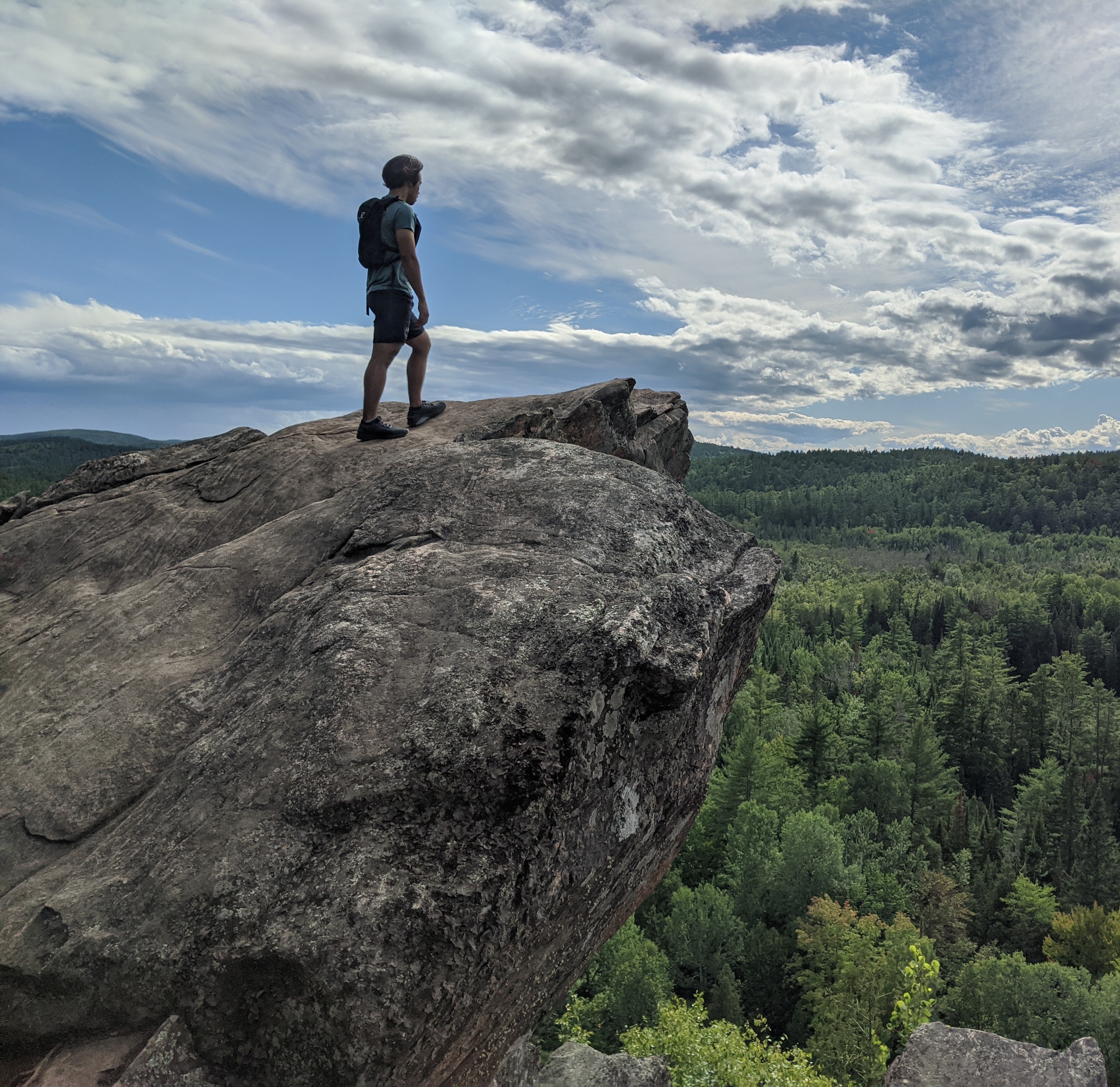 Hans on the edge of a mountain.